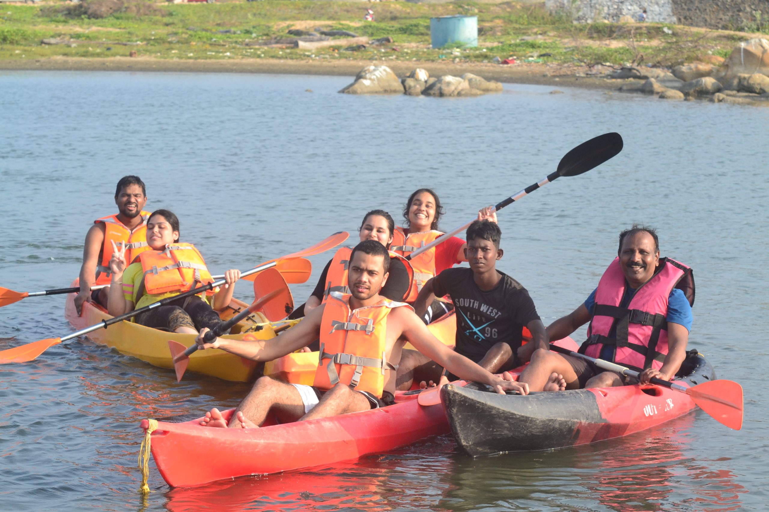 Students enjoying kayaking at Kovalam Beach